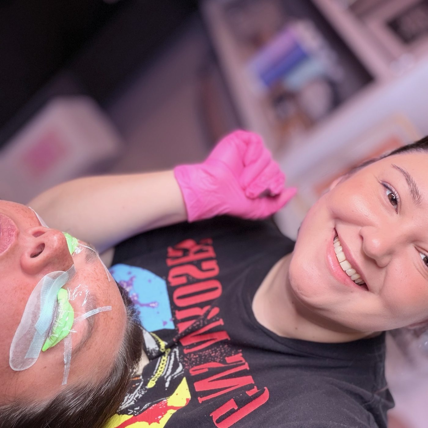 Ciera mid-appointment with a client wearing protective UV glasses
